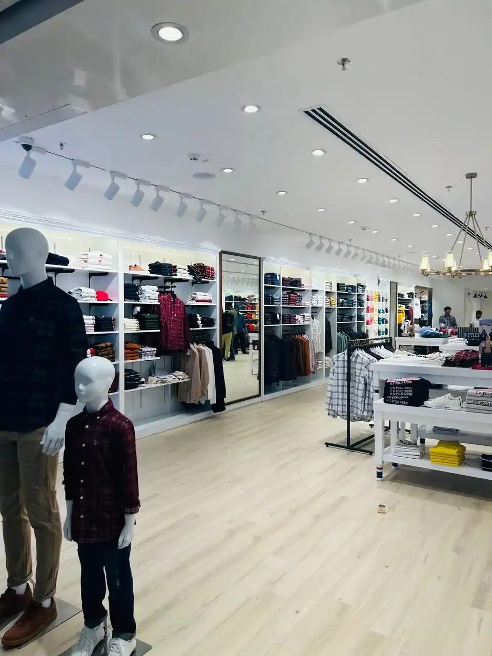 US Polo store interior design , retail store interior design Vadodara , Inorbit Mall store design project , K9 Interiors retail projects , showroom interior design India , fashion store interior design , retail branding and layout design