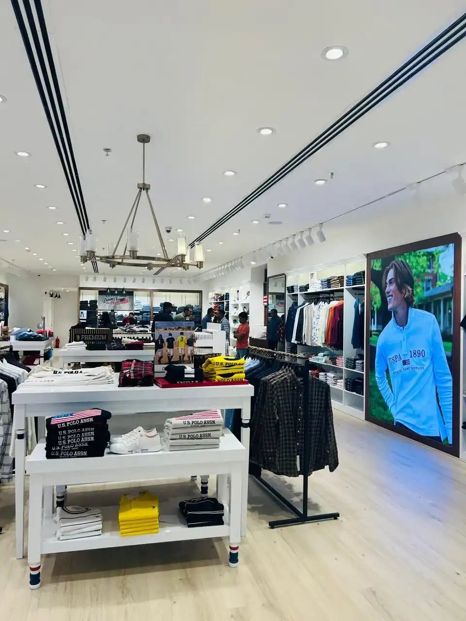 US Polo store interior design , retail store interior design Vadodara , Inorbit Mall store design project , K9 Interiors retail projects , showroom interior design India , fashion store interior design , retail branding and layout design