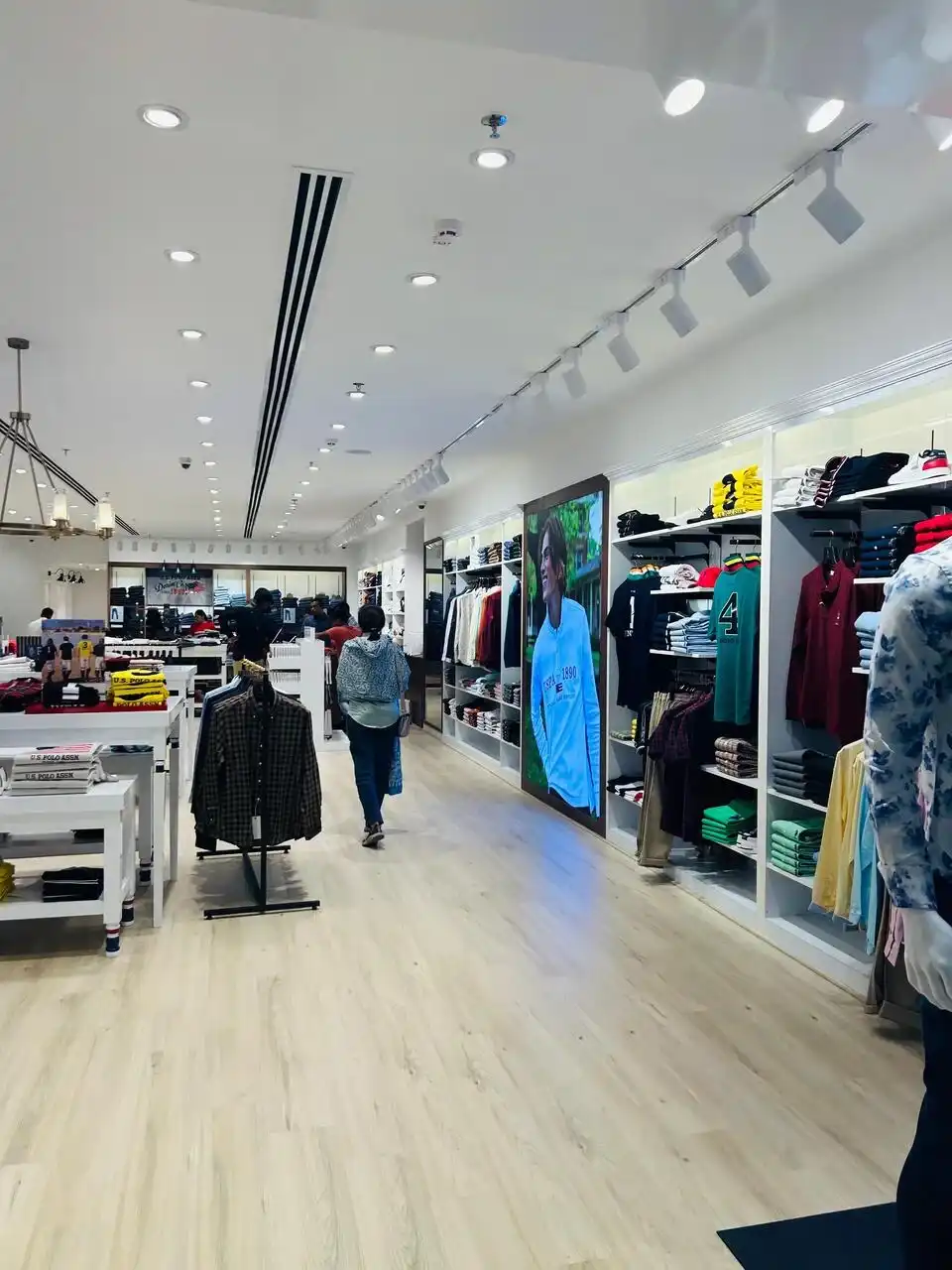 US Polo store interior design , retail store interior design Vadodara , Inorbit Mall store design project , K9 Interiors retail projects , showroom interior design India , fashion store interior design , retail branding and layout design
