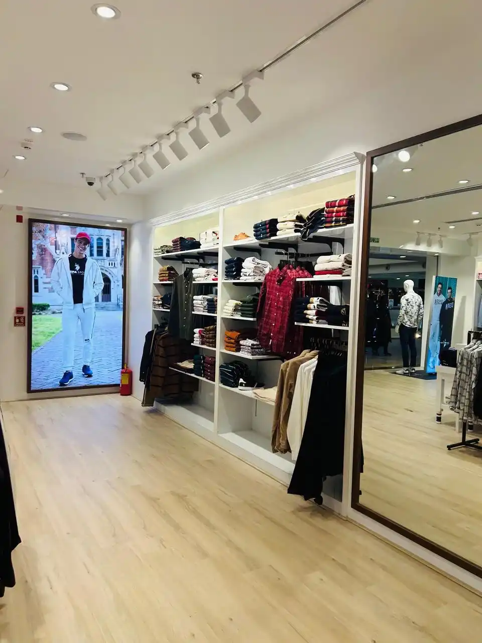 US Polo store interior design , retail store interior design Vadodara , Inorbit Mall store design project , K9 Interiors retail projects , showroom interior design India , fashion store interior design , retail branding and layout design