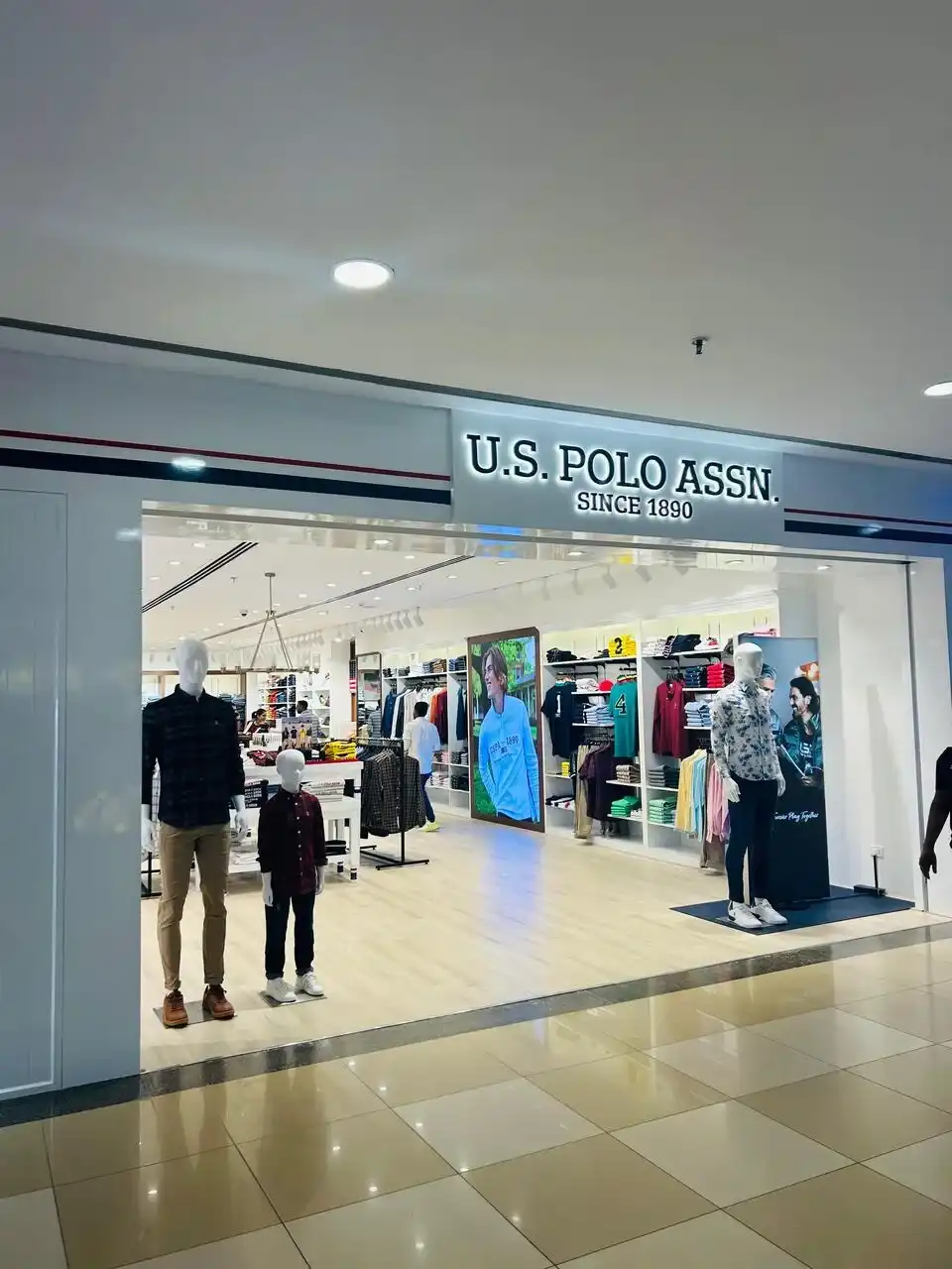 US Polo store interior design , retail store interior design Vadodara , Inorbit Mall store design project , K9 Interiors retail projects , showroom interior design India , fashion store interior design , retail branding and layout design