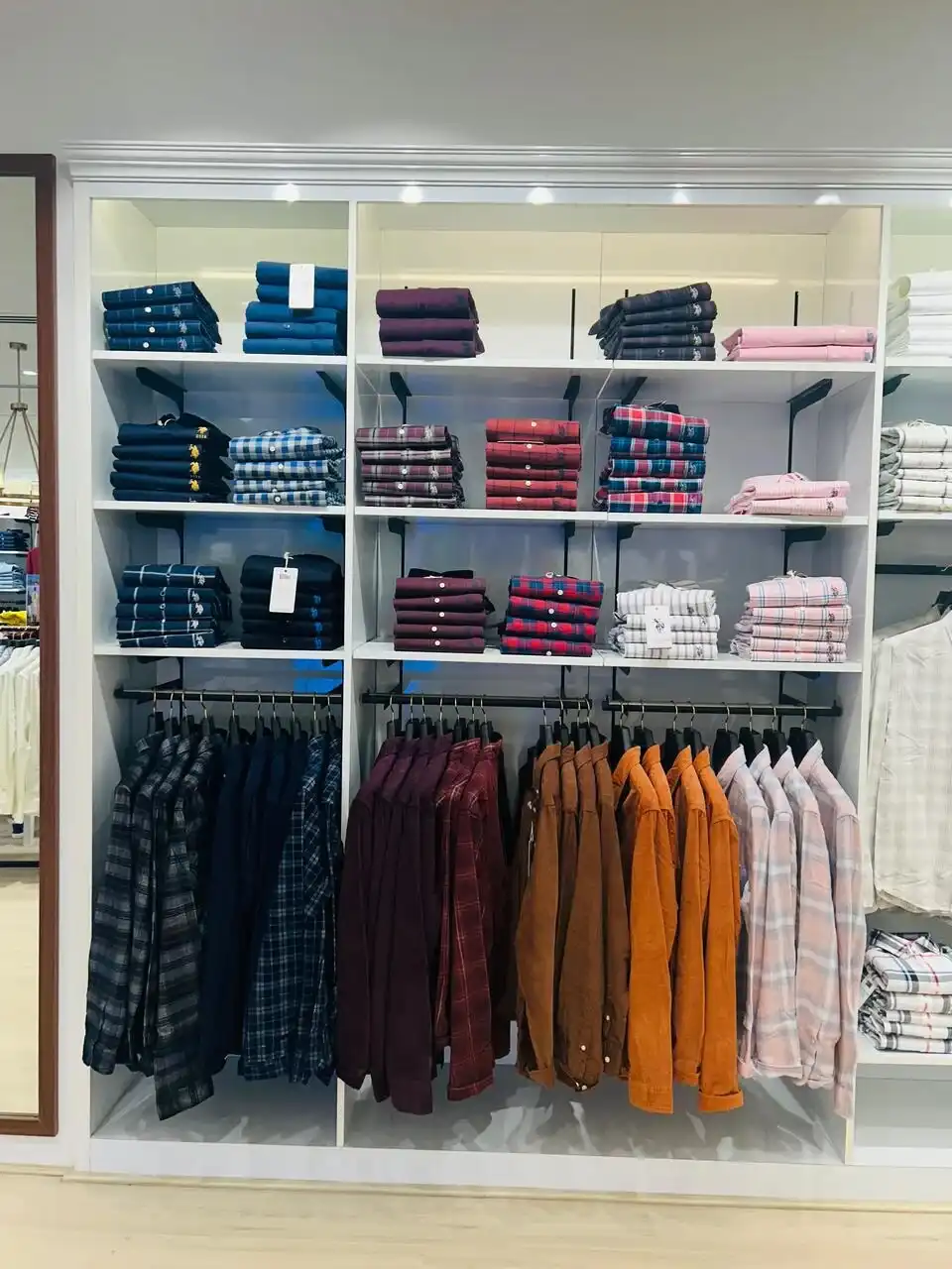 US Polo store interior design , retail store interior design Vadodara , Inorbit Mall store design project , K9 Interiors retail projects , showroom interior design India , fashion store interior design , retail branding and layout design
