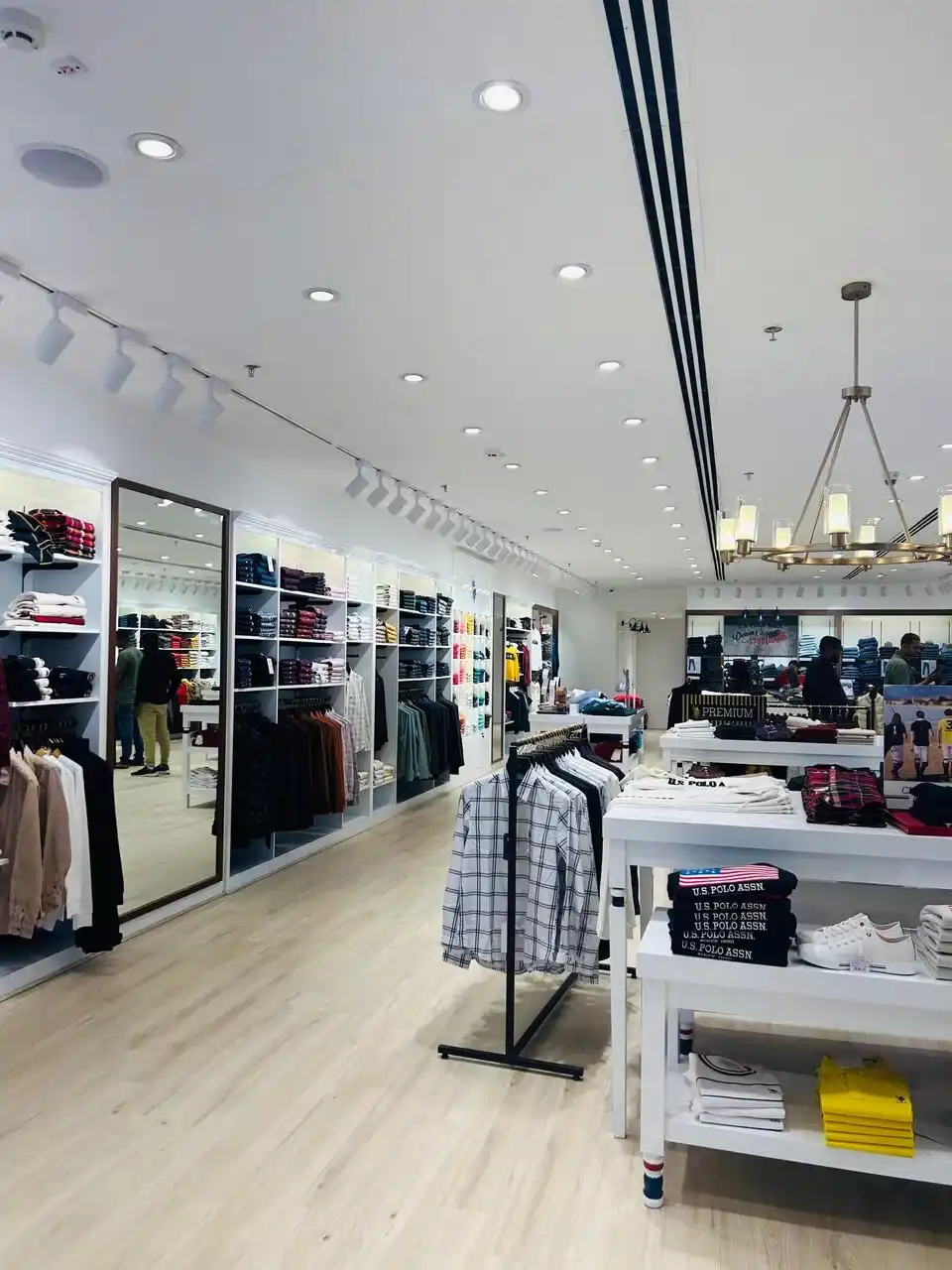 US Polo store interior design , retail store interior design Vadodara , Inorbit Mall store design project , K9 Interiors retail projects , showroom interior design India , fashion store interior design , retail branding and layout design