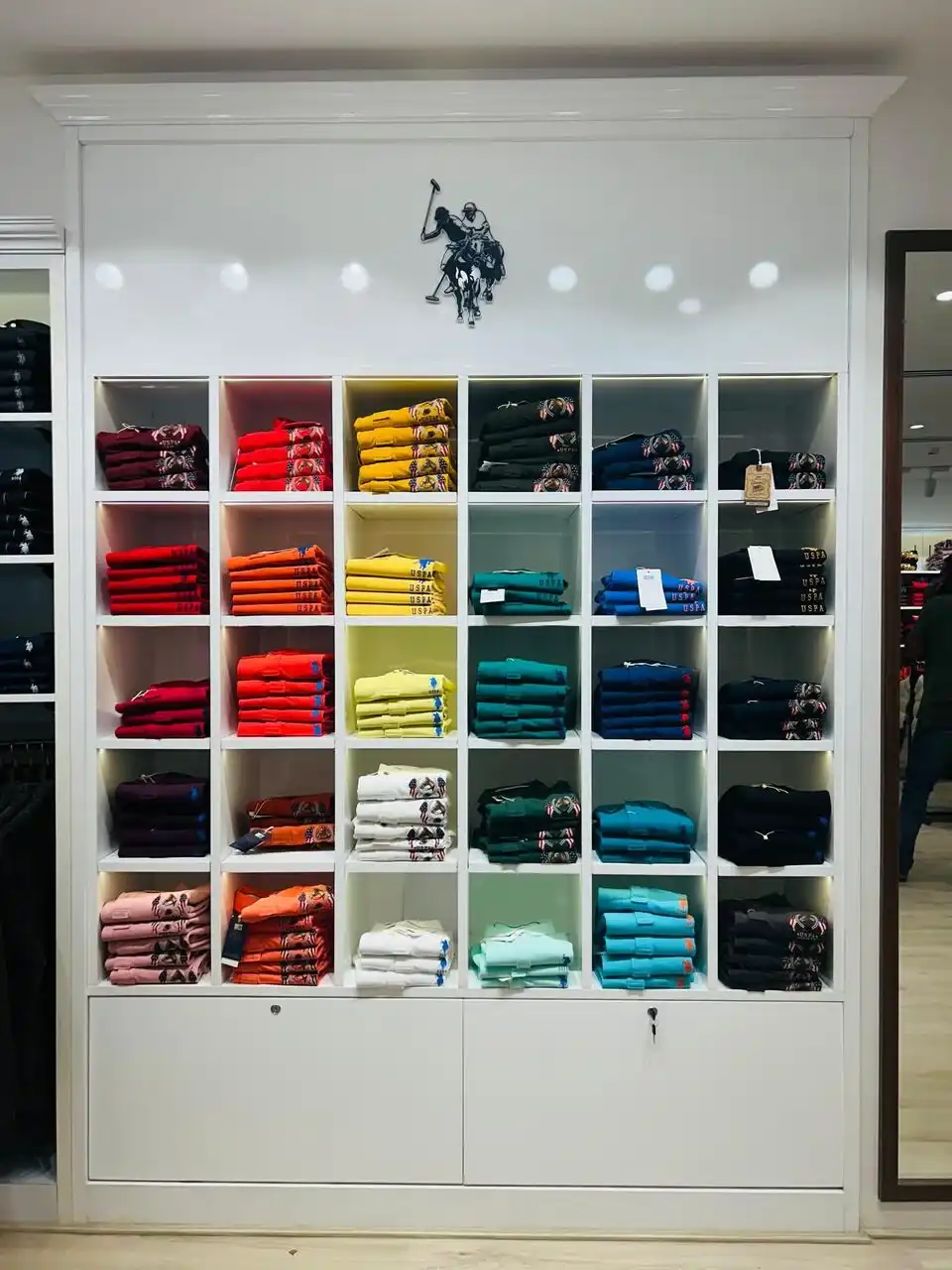 US Polo store interior design , retail store interior design Vadodara , Inorbit Mall store design project , K9 Interiors retail projects , showroom interior design India , fashion store interior design , retail branding and layout design