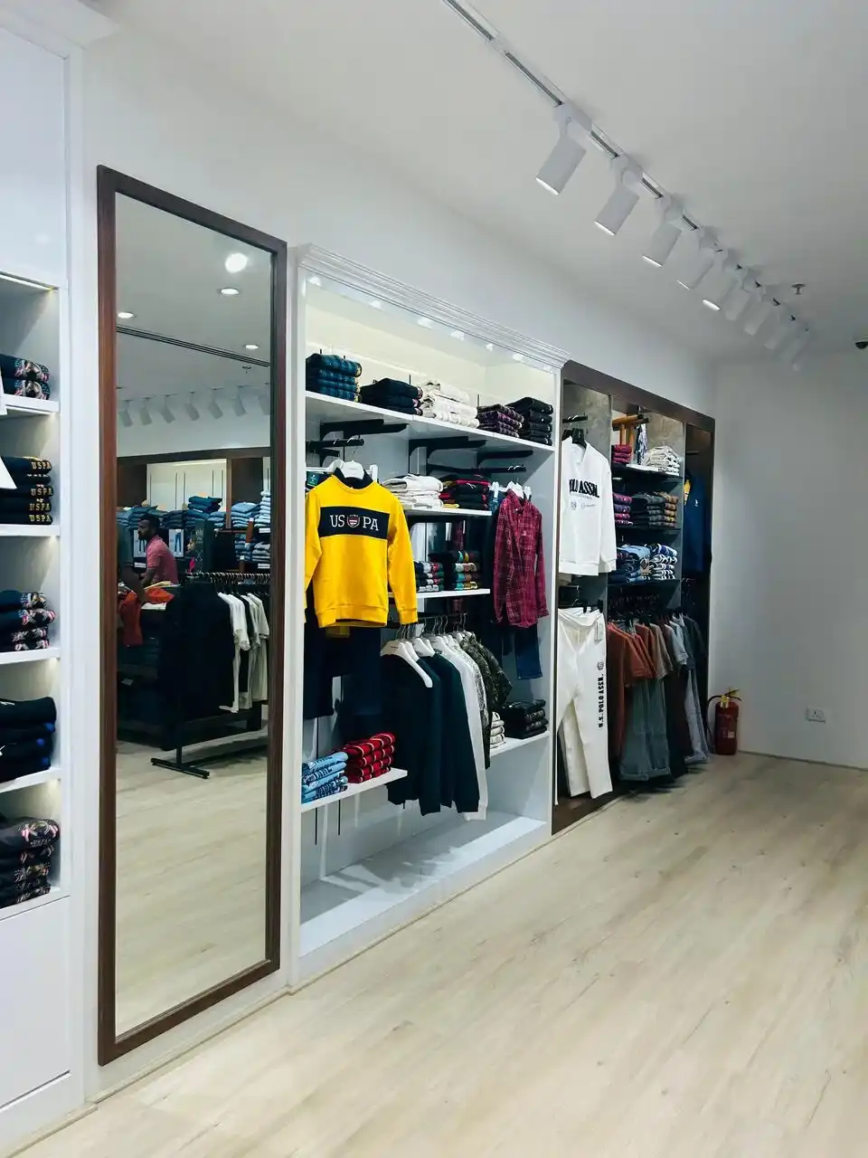 US Polo store interior design , retail store interior design Vadodara , Inorbit Mall store design project , K9 Interiors retail projects , showroom interior design India , fashion store interior design , retail branding and layout design