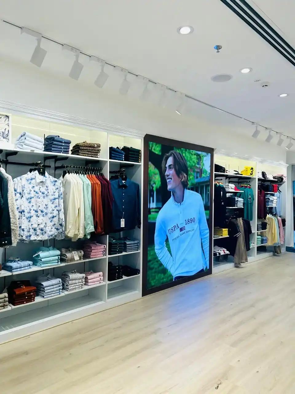 US Polo store interior design , retail store interior design Vadodara , Inorbit Mall store design project , K9 Interiors retail projects , showroom interior design India , fashion store interior design , retail branding and layout design