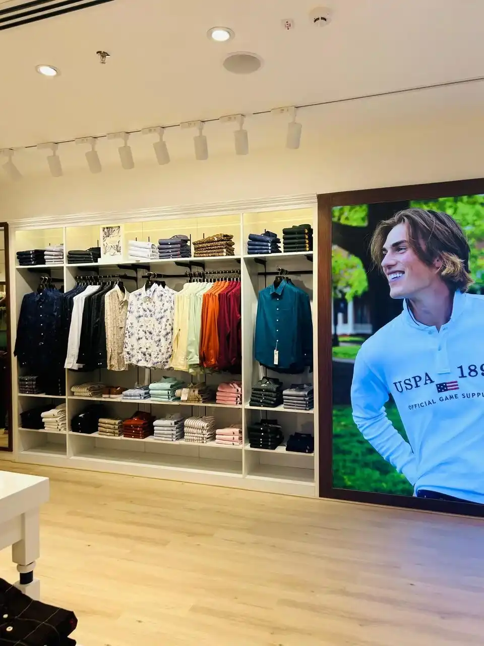 US Polo store interior design , retail store interior design Vadodara , Inorbit Mall store design project , K9 Interiors retail projects , showroom interior design India , fashion store interior design , retail branding and layout design
